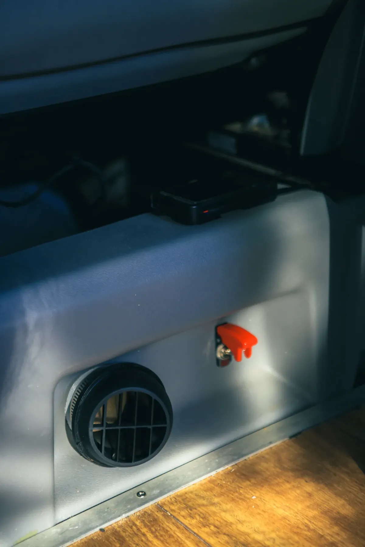 Diesel heater inside Wombat Campers van alt="Interior view of the built-in diesel heater control panel for off-grid winter camping"